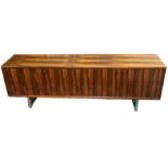 Gordon Russell Furniture - A "Prestige" range rosewood sideboard with chrome legs and hinged doors