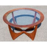 G-Plan - A mid 20th Century "Astra" circular topped glass inset teak coffee table, sticker to