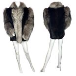 A vintage 1980s fur jacket in  silver fox and ranch mink, the body of the jacket being mink and
