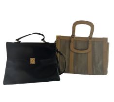 A vintage Lanvin handbag in black leather with a top handle and detachable shoulder strap and gold