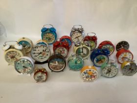 Vintage toy and Novelty clocks to include a German Mickey Mouse alarm top bell clock and many