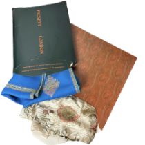 A boxed and tagged silk and lurex jacquard scarf by Etro with paisley and floral motifs inspired