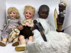 Antique dolls and African carved wooden figures. An Armand Marseille bisque head doll 995 mold