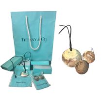 A Tiffany & Co jewellery set, boxed and bagged to include silver necklace and earrings designed by