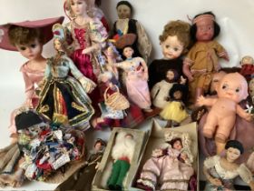A vintage large selection of dolls , to include a 9” detailed peddler doll, 1960 tall teen fashion