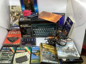 Vintage Sinclair ZX spectrum unit, joystick and various computer tape games and pieces and brochures