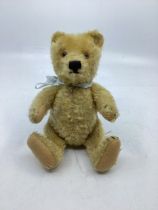 Steiff German small antique teddy bear c 1950s , 8” golden Mohair, part worn  with glass eyes,