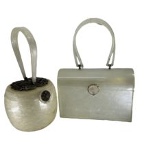 two vintage Lucite handbags, both s/d. one is late 40s in a circular form with paste set fancy metal