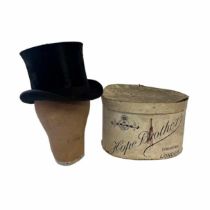 A fine example of an antique silk top hat from the early 20th Century complete with its matching and