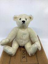 Vintage white mohair teddy bear with flat button in ear , with leather paws and black stitched nose,