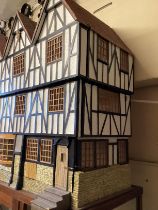 Very large built wooden Tudor styled dolls vintage house  measures c 35/32/17” with opening front -