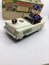 Made in Japan tinplate Mystery Police car, battery operated 9.8ins long white livery police car with