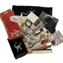 A quantity of vintage costume jewellery, some early 20th century embroidered velvet panels, look