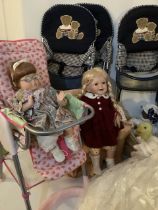 A large collection of dolls and vintage cots bassinets, several teddy bear folding high chairs and