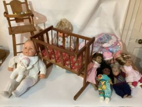 Vintage Baby dolls and a 1953 rocking cradle with printed original base board and various dolls