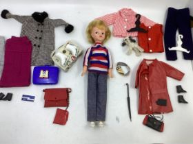 pedigree Sindy doll Made in england( blonde) together with a selection of clothes , together with
