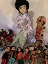 Good vintage collection of Chinese and Asian dolls , to include a large porcelain fine artist