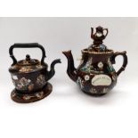 A large late 19th century Bargeware teapot on stand with pressed forget-me-not design to body,