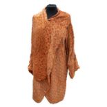 An iconic Chanel coat from the early 1920s - the figured velvet burnt orange coat has pagoda