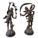 A pair of 19th Century French Spelter Figures on wood stands (2)