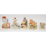 A collection of mid to late 19th century Staffordshire spill and flatback figures and a cottage. A.