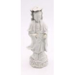 An 18th century Qing dynasty Chinese figure with a serene expression
