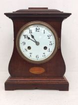 Edwardian mahogany 8-day mantel clock with Arabic numerals and shell inlay detail.