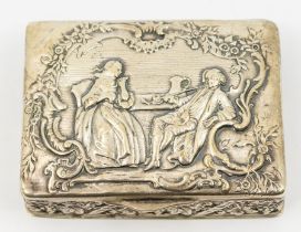 A German 800 standard silver large snuff box, the cover embossed with an 18th Century couple