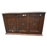 A 17th century oak single door cupboard top, missing the base, with carved front panels.