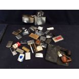 A collection of smoking related ephemera, including Zippo lighters, gold-plated cigarette case,