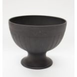 Wedgwood - A black basalt bowl, footed with rib detail, impressed marks to base. Wedgwood, Etruria