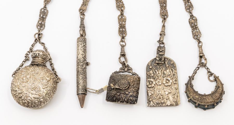 A 19th Century silver plate Chatelaine, the hook applied with Pharaoh's mask, above five chains - Image 2 of 3
