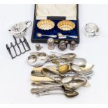 Three early 20th Century graduating silver dredger salts and a miniature silver jersey can