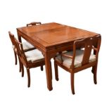 A Chinese style hardwood dining table and 6 chairs, including two carvers, all with upholstered