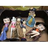 A collection of six Betty Boop figures between 25cm and 30cm high.