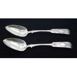 A pair of 19th Century Russian .875 silver fiddle pattern table spoons, ornate decoration to