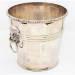 A PMV & Co stamped silver-plated ice bucket with lion's head handles