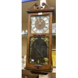 Modern President wall clock contained in a wooden case. Dimensions 28" x 11" x 5" Condition Movement