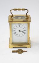 A 20th Century brass cased small carriage clock, handle to top, French movement, maker to front