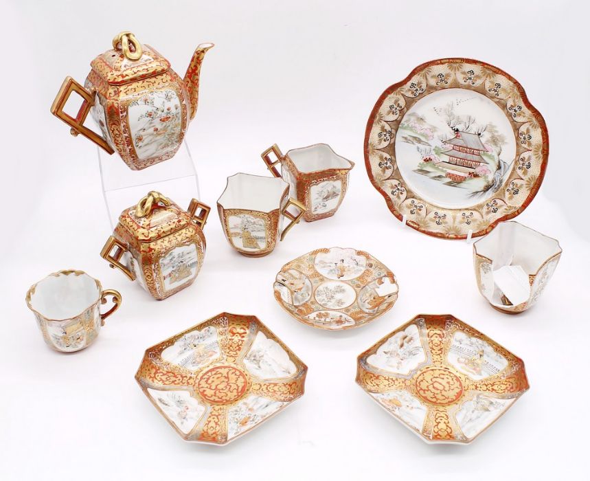 A Japanese Meji period red ground and gilt detailed porcelain part tea set, consisting of tea pot