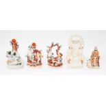 Five Staffordshire figures to include; A laying lady and animal posy holder, a single man with