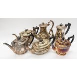 A collection of early 20th century silver plated tea pots, coffee pots, sugar bowls and cream jugs