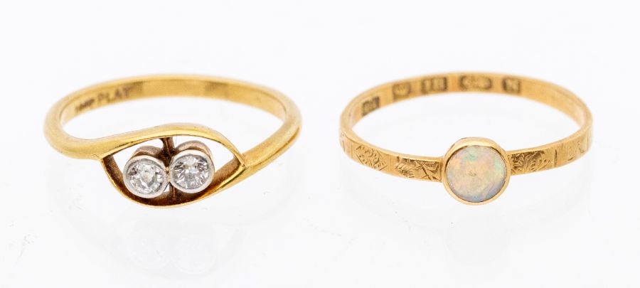 Two early 20th century rings including a two stone diamond and 18ct gold ring, comprising old cut