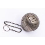 A Continental probably Indian white metal spherical pomander / tea ball, on suspension chain, 40.8