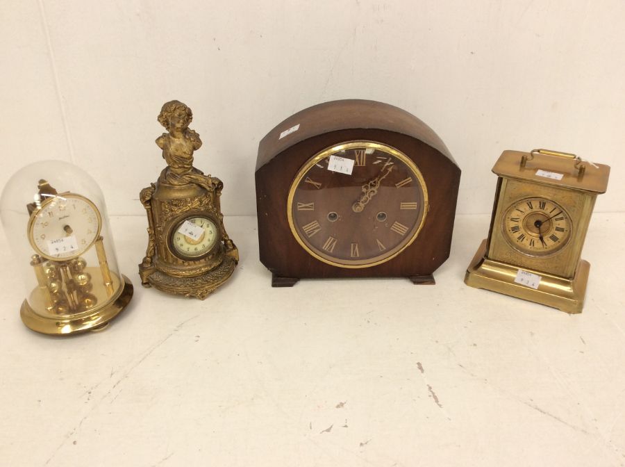 Four mantel clocks: 1. Bentima torsion or 400-day clock; 2. Smiths Enfield two-train mantel clock;