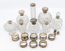 A collection of  early 20th Century silver to include: three graduating sized hob nail cut scent