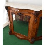 A Victorian marble-topped, mirror-backed chiffonier in mahogany with three mirrored doors