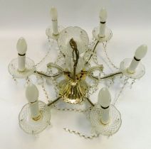 A mid 20th Century six branched ceiling candlelight with glass droplets