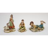 Three Capodimonte figurines: Tom Sawyer, a 19th century boy and a 19th century girl