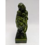 ***WITHDRAWN*** A large green glazed ceramic figure of a lady with two children in arms, perching on